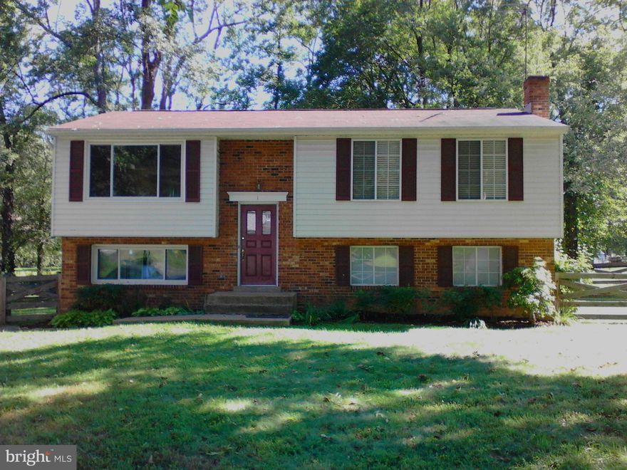 Buyer Ready! Large split foyer located minutes from Quantico's TBS gate. Boast 5 bedrooms 3 Baths with a fenced yard and mature trees. With nearly 2000 sq feet of living space. Tile in foyer and downstairs bathroom. Kitchen has new tile floor, tile counter and back splash. Home is conveniently located Near Shopping, library, parks, VRE and commuter lots.