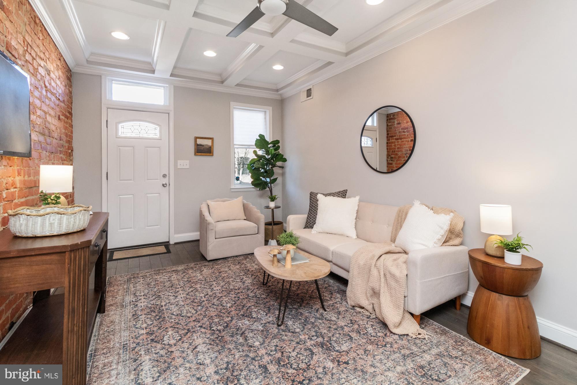 13 foot wide row home now available on an extremely sought-after block in Canton. Parking pad out back & 2 tiered rooftop deck. Brand new carpet and fresh paint. Glistening hardwoods cascade throughout with tons of natural light. Enjoy your coffered ceilings, exposed brick and half bath on the main floor. In the designer chef's kitchen you will find high end white cabinetry, upgraded trim and paint, imported tile, granite countertops, and upgraded stainless steel appliances. Off the kitchen there is a designated entrance for the parking pad. Upstairs you'll find two bedrooms, and a large hall bathroom with a double vanity. Off the rear bedroom you will access the two tiered rooftop deck with amazing views of the Baltimore City Skyline and the Inner Harbor. The finished lower level with high ceilings includes an additional bedroom, living space, full bathroom and laundry and storage area. Major whole house renovation completed in 2017. Close proximity to retail shopping, local dining, Patterson Park and all major highways. Schedule a private tour today.