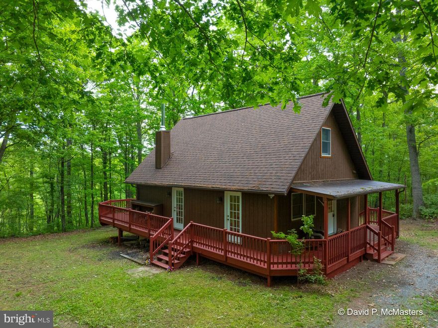 WILD AND WONDERFULL CABIN ON  5.13 AC. OFF STATE MAINTAINED  ROAD-NO HOA - LOFT BEDROOM -HEATED  ELECTRIC B/B  AN  STONE  FIREPLACE FLUEWOOD STOVE(  WITH A STORY-) WOOD FLOORS-OPEN  LIVING WITH EXTRA  B/R OR  OFFICE ON MAIN LEVELWITH IT OWN ENTRANCE-DECK IS OPEN AND ALSO COVER -PRIVATE WITH LOCK GATE DRIVEWAY -ROOF IS  LESS THAN 7  YEARS OLD -2 STORAGE  BUILDING  WHICH ACCENT THE  PROPERTY-CRAWL SPACE  WITH LOCK DOORS AND CAN STAND  UP IN WOOKSHOP UTILITY AREA --WELL AND SEPTIC-IDEAL FOR STARTED HOME OR PART TIME VISTS TO GET AWAY FROM  CITY- BEING SOLD AS IS BUT WELL KEEP -PRIVATE -RURAL- CLOSE  TO W VA. STATE FOREST  SLEEPY CREEK 2 MILES FISH AND HUNTING -ALL  APPLIANCES CONVEY WHAT ARE THERE- VERY RARE FIND--