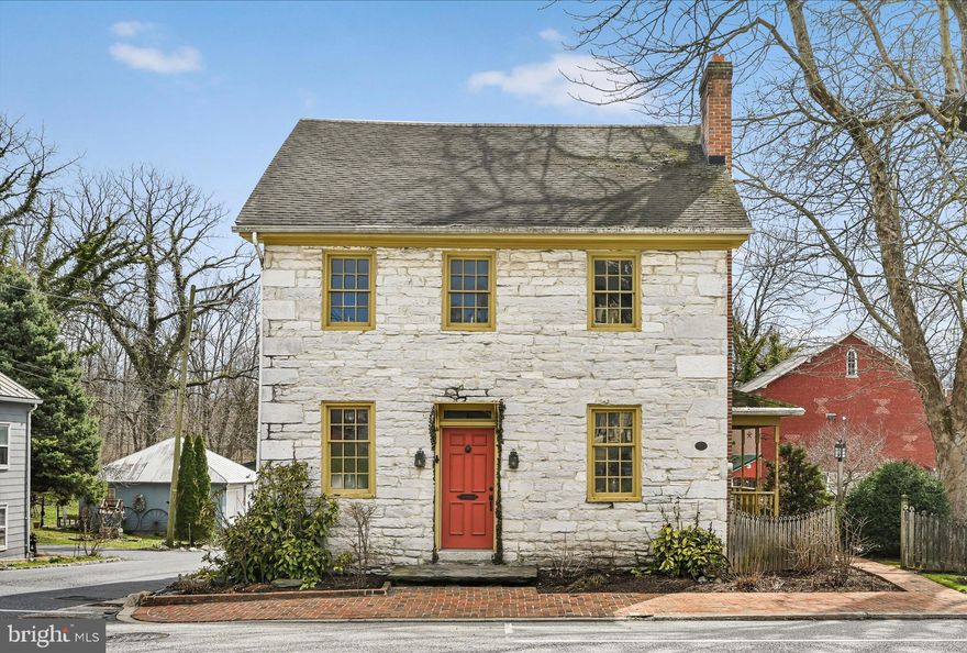 Step back in time with this exceptional historic stone home, built in 1750, ideally located in the heart of Annville on a picturesque lot shaded by mature trees. Just a short walk to local restaurants, downtown shops, parks, schools, and Lebanon Valley College, this property offers the perfect blend of charm, history, and everyday convenience.
Offering nearly 3,000 square feet of living space, this home features 5 bedrooms and 1.5 baths, highlighted by beautiful original details and thoughtfully crafted wooden built-ins that perfectly complement the home’s historic character. Modern comforts have been carefully integrated, including central air conditioning, an efficient gas furnace, insulated walls, and a gas fireplace in the living room, providing year-round comfort and energy efficiency.
Lovingly owned and meticulously cared for by the same family for the past 46 years, pride of ownership is evident throughout. Unique features include brick sidewalks, brick flooring, distinctive windows, and stunning grounds that have hosted many memorable celebrations and gatherings over the years. This is a rare opportunity to own a truly special home filled with warmth, history, and timeless appeal—right in downtown Annville.