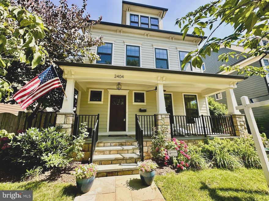 Step into Lyon Village—one of Arlington’s most sought-after neighborhoods, known for its charming tree-lined streets, beautiful homes, and unbeatable proximity to Clarendon’s vibrant dining and shopping scene. From the moment you arrive at 2404 16th St N, this BeaconCrest-built home invites you to experience the perfect balance of elegance, comfort, and modern convenience. Thoughtfully designed across four finished levels, it offers stunning details, high-end finishes, and a versatile layout that adapts to every stage of life.

The main level is designed for both seamless entertaining and cozy nights in. Imagine curling up by the double-sided gas fireplace, which warms both the living and dining areas, creating the perfect ambiance for gatherings or a quiet evening with a book. The coffered ceilings and custom built-ins add timeless character, while the full bath on this level provides added flexibility for guests. In the gourmet kitchen, you’ll love preparing meals with Thermador® appliances, a gas range and wall oven, and a stunning waterfall granite island that serves as the heart of the home. The walk-in pantry and wood-paneled refrigerator maintain the sleek aesthetic while keeping everything within reach. Step outside to the covered back porch, ideal for year-round grilling, or continue to the professionally landscaped, fully fenced-in backyard, where the top-of-the-line jacuzzi hot tub awaits for relaxing evenings. The yard also provides direct access to the detached two-car garage and ADU, with a private alleyway ensuring easy and discreet entry.

On the second level, the primary suite offers a peaceful retreat at the end of the day. The diamond coffered ceiling adds a touch of sophistication, while the two walk-in closets provide ample storage. The spa-like ensuite bath, complete with a waterfall shower-head and double vanity with extra storage, transforms everyday routines into a luxurious experience. Two additional bedrooms on this level share a beautifully appointed Jack-and-Jill bath, designed with pocket doors for privacy. The convenient second-floor laundry room makes chores effortless, so you can spend more time enjoying your home.

The third level offers incredible versatility—a spacious loft, an additional bedroom, and a full bath with dual sinks and a soaking tub make this the perfect space for a guest suite, home office, or creative retreat. With two extra storage closets, this level is both functional and inviting.

The fully finished lower level expands the home’s living space, featuring new luxury vinyl plank flooring, gas fireplace with built-ins, a new half bath, a generous storage room, and a wet bar that’s perfect for hosting. The TV and refrigerator convey, making this the ideal space for a media room, home gym, or game room. With a split-zone HVAC system, a tankless water heater, and an additional water heater, your home remains energy-efficient and comfortable year-round.

Above the detached garage, the one-bedroom, one-bath accessory dwelling unit (ADU) provides a private and flexible space. Whether you use it for guests, an au pair suite, rental income, or a separate home office, this suite is a valuable extension of the home, complete with two closets and a full bath with a tub.

Living in Lyon Village means living your best life—whether you’re dining at your favorite local spot, shopping in nearby Clarendon, or taking the metro into DC, the location puts everything you need within reach. With top-rated schools, parks, and a strong sense of community, it’s a favorite for those looking for a blend of urban convenience and suburban charm. This home offers a lifestyle that blends luxury, convenience, and a true sense of community. From hosting lively gatherings by the fireplace to unwinding in the jacuzzi tub and enjoying the nearby parks, shops, and dining, every day here feels special.