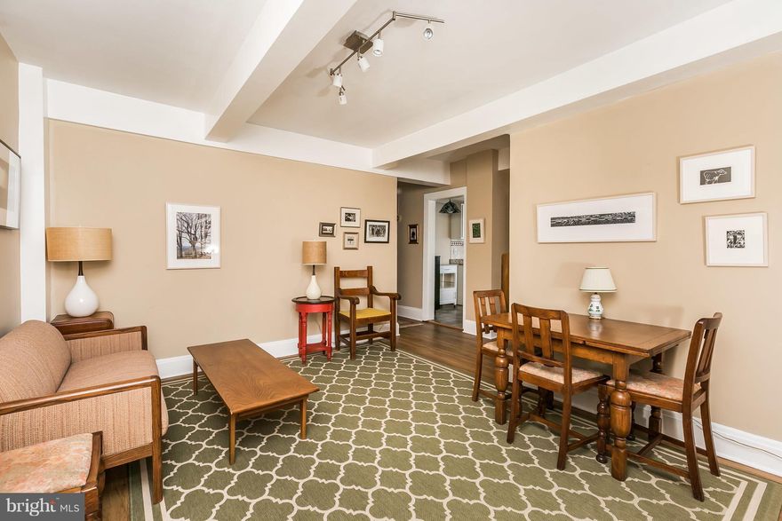 Coop living = maintenance free living. Fees include TAXES, heat, water, sewer, exterior building maintenance, lawn care, master insurance policy, and storage rooms! This ground level unit features a private entrance and covered patio. The inviting and updated kitchen features granite counters, white cabinets, tile floors, a gas stove, and dishwasher. The master bedroom has lots of natural light and an en-suite bathroom. The 2nd bedroom is perfect for guests or an office. This Italianate building built in 1915 fits in perfectly to the well maintained gardens that surround it.