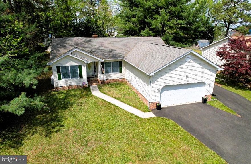 OPEN HOUSE CANCELLED! Presenting this fantastic 3 Bedroom, 2 Full Bathroom rancher and two car garage tucked away in a peaceful and private setting within the highly desirable water favored community of Bay City. Situated on a .48 lot, this home invites you to embrace the soothing shores on Maryland's Eastern Shore. This home also features a 425 square foot Family Room Addition with Vaulted Ceilings (2005), Living Room with propane Fireplace, Primary Bedroom with Primary Bathroom (tub and separate shower),  rear deck , shed and a level rear yard. Nearby is a large park and playground with direct view of the Chesapeake Bay as well as a Community Pavilion and a boat ramp on Broad Creek. 
Additional info...
Roof 2011, HVAC 2013, Propane Water Heater 2017, Generator is As-IS.