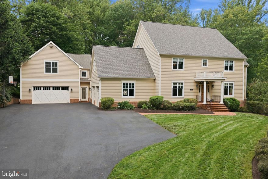 A rare opportunity to enjoy the privacy of a four-acre estate while remaining close to town, shopping, and major commuter routes!  Set far back from Hunter Mill Road, this exceptional property combines serene surroundings with unmatched accessibility — truly the best of both worlds.   The additional  detached garage with finished living space could be used as a guest house or on site office.  Beautifully updated throughout, the main level features a stunning new kitchen, formal living and dining rooms, family room leading to a large covered porch and deck, private study with built ins, and a mud room.  Upstairs is a wonderful primary suite with show stopping bathroom and amazing closets.  There are three additional bedrooms, two updated full bathrooms and a new laundry room.  A bonus loft level features two additional rooms, currently being used as a playroom and craft room. This is ideal flex space for work, hobbies, fitness, or guests.  The walk-out lower level offers exceptional recreation space including a game room, wet bar, theater room, bedroom, and full bath. Step outside to a gorgeous patio complete with hot tub for year-round enjoyment.  A built-in sound system enhances the home's entertaining appeal.  Updates include a new roof, all new wood flooring, carpeting, painting, lighting fixtures and new asphalt driveway.  A standout feature of the property is the oversized detached two-car garage with approximately 600 square feet of finished living space above, complete with a kitchenette and half bath that could easily be converted to a full bath. Perfect for an office, studio, or guest suite. With four oversized garage spaces, extensive driveway parking, wooded privacy, and a location less than five minutes to I-66, the Dulles Toll Road, grocery stores, and town amenities, this property delivers an extraordinary lifestyle rarely found in today’s market.