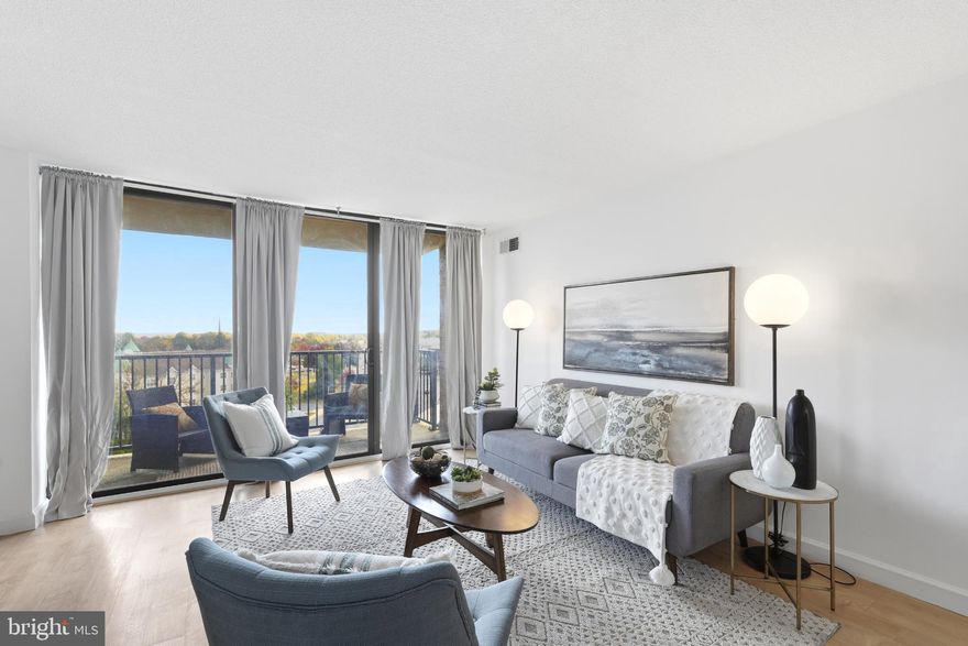 **NEW PRICE! - $10,000 PRICE REDUCTION** Welcome to American Centre, where urban convenience meets stylish comfort in this beautifully refreshed one-bedroom, one-bathroom condo. The home features wide-plank luxury vinyl flooring and a spacious, light-filled living room that opens to a private balcony with expansive city views—perfect for enjoying morning coffee or evening sunsets. Enjoy the separate dining area with easy access to the updated kitchen with stainless appliances and ample cabinet and counter space. 

The generously sized bedroom offers a walk-in closet, providing plenty of storage space, while the bathroom is easily accessible from both the bedroom and main living area. Residents enjoy the added perk of free washer and dryer access on every floor, along with ALL UTILITIES INCLUDED IN THE MONTHLY FEE—truly hassle-free living. Plus, ONE GARAGE PARKING SPACE IS INCLUDED to make parking a breeze. 

This well-maintained building offers an array of desirable amenities, including an outdoor pool, a 24/7 concierge, a fully equipped fitness center, a stylish lobby, a community room, and secure package storage.

Situated in the heart of Rockville, this location places you near the Metro, Trader Joe’s, a seasonal outdoor skating rink, and a vibrant mix of restaurants, cafés, and shops. It’s the perfect place to enjoy a connected, convenient lifestyle in one of Montgomery County’s most accessible communities.