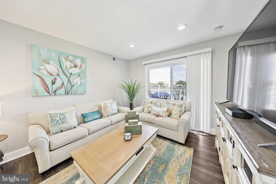 This is 3 bedroom 2 bathroom townhome that was completely renovated within the past year. This home has a brand new HVAC system and Water Heater. Complete renovation is not an exaggeration, as the owner took the home down to the studs and completely redid everything from the walls, to the floors, to all bathrooms and the kitchen. The builder also created an owners suite bedroom with en-suite owners bathrooms. There is an outdoor deck that can be accessed from the owners suite as well as access from the living room. Sit and enjoy the water view of the  inlet from your home. This boat slip is deeded to the home and has a boat motor to pull up and drop your boat depending on the tide. The home is located right across the street from a public beach access, so it take less than 5 minutes to walk to the beach and dig your toes into the sand. There is a private pool that all members of this community  have access to. The condo is located right beside a the Green Turtle shopping center and there is even a walk way to the Food Lion grocery store that is only a 2 minute walk from the home. There is an options to include all of the brand new furniture into the sale. Please ask agent for furniture details.