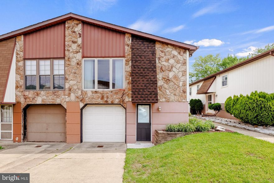 Welcome to this stunning 2,440 sq ft, 3-bedroom, 3-bath twin home in the sought-after Timberwalk community—peacefully tucked away, yet close to everything.  From the moment you arrive, you'll appreciate the private driveway and garage accommodating 1 car. Enter through the side door and enjoy the fragrance of lovingly tended flowers that set the tone for what’s inside.   Step into a dramatic entryway with a skylight that fills the space with natural light. Upstairs, you'll find a beautiful kitchen featuring elegant cabinetry, countertops, and a breakfast bar—ideal for entertaining. The bright living room, highlighted by a picture window and gleaming floors, flows seamlessly into the dining area.    This home offers three spacious bedrooms and three stylish tiled bathrooms—including a private en suite in the primary bedroom. The lower level, is currently used as a cozy sitting room. This level also includes a convenient laundry room and a generous den with direct access to  an expansive backyard—perfect for relaxing or hosting guests.