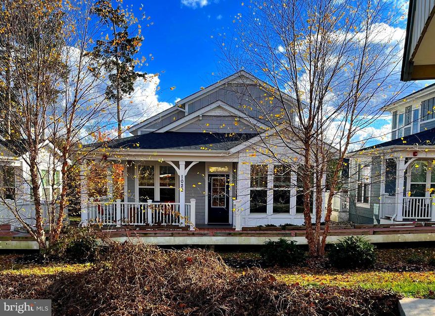 ***OPEN HOUSE DEC 7, 12-2 PM CANCELLED***

Welcome to this rarely available 55+ single family home in the heart of Falls Church City!

Winner of the Urban Land Institute 2019 Award for Excellence in Residential Development, the Railroad Cottages offer a perfect downsizing alternative to multi-story condos with the same low-maintenance appeal.  Each charming home features private outdoor space for a pet or garden, and covered parking.
Designed for comfort and accessibility, this home offers an abundance of natural light, 9-foot ceilings, and a seamless, step-free layout on the main level. 

The front door opens up to a bright living room boasting custom built-ins and an adjacent spacious kitchen with espresso stained cabinets, stainless steel appliances and a center island. The dining area overlooks the picturesque boardwalk and the community grounds with the old Railroad station. The owner’s suite is located on this level and offers an ensuite windowed bathroom with separate zero-threshold walk-in shower and a large walk-in closet. A half bath and laundry closet is also located on this level.

The upper level has a second bedroom with an ensuite windowed full bath with a soaking tub as well as a practical walk-in closet. Also located on this level is a large floored attic perfect for storage.
Built with Universal Design principles and certified EarthCraft Gold, the home features geothermal heating and cooling, 2x6 construction, and superior insulation. Solar panels on the carport provide energy for a car charging station, common area lighting, and The Common House.

The Common House fosters community with an entertainer’s kitchen, dining for 20, a cozy living area, and a guest suite for visitors. It also serves as a backup power hub for comfort during outages.

The monthly dues cover landscaping, snow removal, ALL exterior building maintenance, common area and Common House maintenance, parking, water, trash & sewer. 

Located steps away from the Washington & Old Dominion Trail and just a block from Broad St., this home offers easy access to public transportation (West Falls Church Metro minutes away), shops, dining, and entertainment in Falls Church City. Experience this thoughtfully designed, vibrant neighborhood, where connection and convenience come together beautifully.