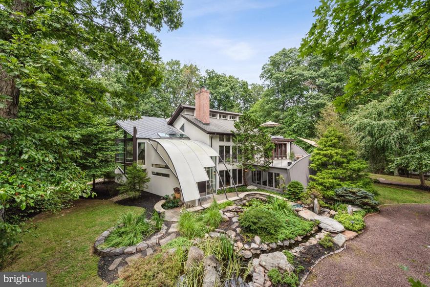 Discover this exquisite contemporary home in the sought-after community of Great Falls, VA. Designed with a perfect blend of style and functionality, this residence offers an unparalleled living experience. This Stunning Home is situated on a beautifully landscaped lot that offers privacy. 
The outdoor space features: custom stonework, professional landscaping with 3 gorgeous ponds and a hut tub.
The house features patios and decks on each level. The open floor plan combined with
extra high vaulted ceilings allow for natural sunlight to fill the interior. The skylights and oversized windows are perfect for enjoying the tranquility of the surrounding woods. The expansive decks and patios are great for entertaining your guests. This 4700 Square Foot Home features: 3 Bedrooms, 2 Full Baths and 2 Half Baths. The garage has ample parking for 3 cars and storage. Other features include: Storage Shed, Gym, and a Theatre Room. The whole house generator, tank-less water heater, 2 zone heating and AC, 2 gas fireplaces and 1 wood burning fireplace ensure your comfort year round. The primary bedroom suite features a private outdoor deck, Custom California walk-in Closet, Spa like Bath with dual vanities, custom shower and soaking tub. Only minutes from the village of Great Falls, the location offers easy access to top-rated schools, upscale shopping, fine dining, and outdoor recreational activities. This modern gem is the perfect blend of luxury, privacy, and convenience—an opportunity you won’t want to miss.