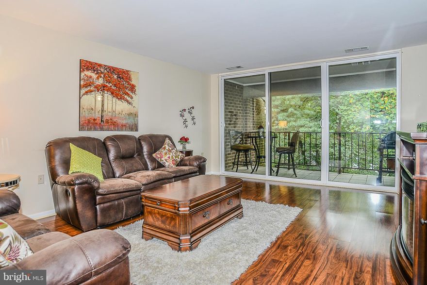 NEW PRICE! Completely remodeled 2 bedroom, penthouse condo. Kitchen w/refaced cabinets, lighting, floors, Corian counters & SS appliances. Spacious living room. Wall of windows opens to tile balcony & backs to trees. Updated bathroom with ceramic tile. Condo fee INCLUDES ALL UTILITIES! Walk to Lake Anne, Farmers Market, dining & shops. Convenient guest parking.  Bus to new Silver Line METRO.