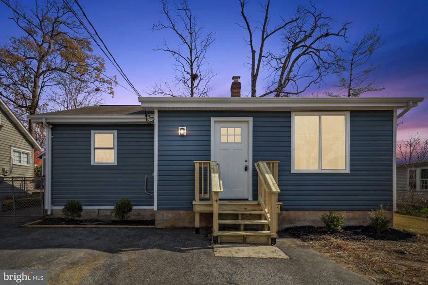 Completely updated only 1 block from water !!  This adorable single family home features an updated kitchen, updated baths, new paint and flooring