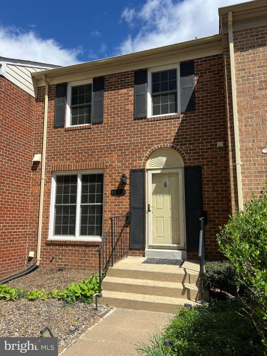 Lovely brick TH: 3BR, 2.5BA, fully finished basement w/wet bar and walk-out to rear fenced-in patio/backyard with extended newly finished patio area.  New carpet in bedrooms and basement.  Hardwood floors on main level.   Front & rear yards have recently been cleaned/trimmed/landscaped.  View out the rear to wooded area.  Kings Park West located just off Braddock Rd close to University Mall.  Two assigned parking spaces & additional visitor parking along white-painted curbs.  Owner just renovated TH - ready for move-in with: new paint, door & windows replaced within the last few years, hardwood floors cleaned, carpet just replaced, etc.  Available for a 2-yr lease term at $3,000/mo  OR 1-yr lease term for $3,200/mo.  Sentrilock lockbox on railing.