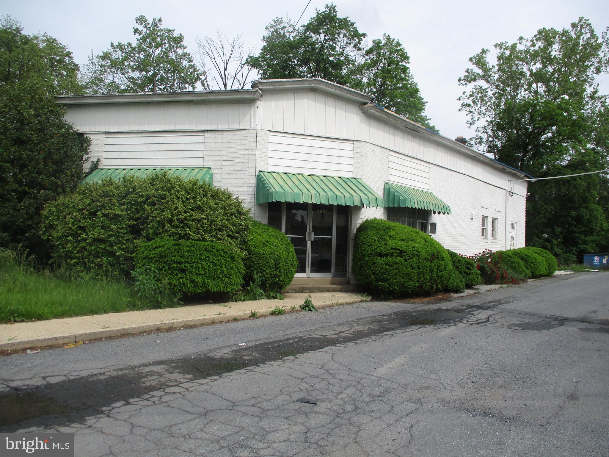 3 Spring Valley Rd, Reading PA, is approximately an 11,000 SF building for sale, consisting of a warehouse connected to an office building. The warehouse is roughly 8,800 SF (85' x 104') with ceiling heights of 15' sloping down to 13'. There are two roll up doors in the drive through bay (20' x 103') of 14' x 12' and 12' x 10' with 15' ceiling heights. There are two bathrooms in the warehouse. The property is on public water, and sewer. The office consists of 2,200 SF with 1400 SF first floor with one the first floor and 800 SF on the second. The office has separate utilities from the warehouse. This parcel is located in I-2 Heavy Industrial District. Several uses include manufacturing, mini warehouses or self-storage units, warehousing, wholesale and distribution, fabrication and finishing establishments, retail business establishments, business and professional offices. This property is located near major routes 12, 61, 222, 422,and route 10.