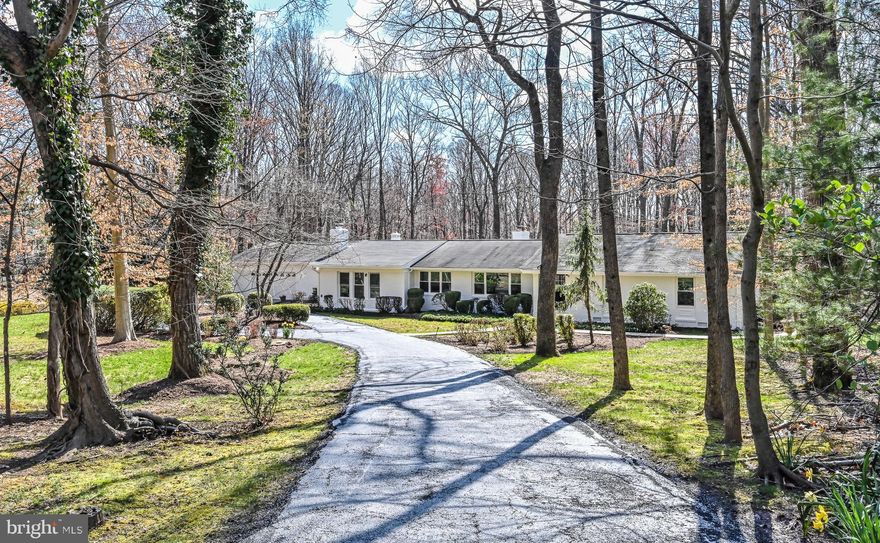 Come check out this 5 acre wooded treasure nestled in the heart of Great Falls. This well designed home offers unparalleled privacy and has been RENOVATED from TOP to BOTTOM.   It truly is MAIN LEVEL LIVING at it's finest!  Open the front door to be greeted by beautiful wide plank hardwood floors that carry you throughout!  Freshly painted and MOVE IN READY! Separate Living and Dining rooms, a large office, and a sun porch extension with views that have you never wanting to leave. The Gourmet Chef’s Kitchen is certainly a focal point with it's white quartz countertops, white shaker slow close cabinets, tile backsplash, stainless steel appliances, designer pendant lighting  and a huge center Island.  The inviting breakfast nook is perfect for everyday meals with more views of mother nature! The Primary Bedroom is a statement as well with his and her walk in closets and it's own exit to the outside.  The custom  luxury bathroom is sure to impress,  it offers a double vanity and and a HUGE shower with only the finest designer touches!  Three remaining bedrooms are generous in size and the two additional full bathrooms have both been fully renovated as well.   The walkout lower level offers additional recreational space perfect for a den, gym or whatever your heart desires.   Bonus is a HUGE crawl space for storage!! Head outside and enjoy all the outdoor living space opportunities.  The large deck and firepit area make for enjoyable spring, summer and fall entertainment!    This property Is well maintained and sure to impress.  Minutes to many commuter highways, Metro, Dining And Shopping!  This one surely won't last long!