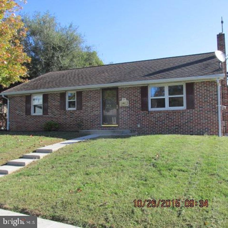 Brick rancher on nice lot. Enclosed back porch. Eat-in kitchen. Wood floors. Three bedrooms. Attic access. Full basement with outside entrance. Oversized one car brick detached garage. Replacement windows.
