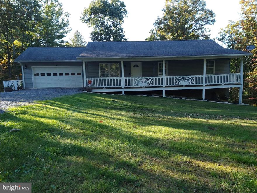 Come home to this beautifully remodeled 4 Bed/3 FULL Bath within the Hickory Corner Subdivision. This home is perfect for a family that wants great country living, but near enough to cities, jobs, medical services, schools, and shopping. Home sits on 2.17 acres with plenty of room to bow hunt in the Holler out back, large front yard, private driveway, lots of off-street parking, huge 19X22 garage, outback patio area, fire pit, covered porch and home is near the end of street leaving you with even more peace and quiet. Seller has updated so much throughout the home. The entire interior of the home has been repainted in the last 12 months. The wooden floors though out the first floor are in excellent shape. The home boasts a huge 8X5 walk in closet. All 3 bathrooms have been remodeled with all the bells and whistles, including: Bluetooth ceiling Speaker, large garden tub, and nice ceramic work. Through the patio doors off from the huge eat in Kitchen is a large deck, perfect for morning coffee, entertaining and watching the wildlife. 

Home has a brand-new everything 2nd Kitchen in the downstairs. New cabinets and quartz countertops offer an updated look. Down stairs could be great for entertaining, Man-Cave, In-Law Suite, or could be easily converted into a rental with separate access from the main floor. The spacious Laundry Room has plentiful storage and the washer and dryer convey with the sale! Home has a brand-new water filtration system. Rest easy with the well-maintained heat pump and central AC with a flue and exhaust insert for a wood or pellet stove in the downstairs. All appliances convey with the sale of the property. Property lines have been marked with green stakes. 

The property is less than an hour drive from Winchester, VA,  Cumberland, MD, and Martinsburg/Romney/ Berkeley Springs, WV. There is an HOA for the neighborhood. Owner says the HOA is lax, friendly neighbors, and quiet neighborhood.