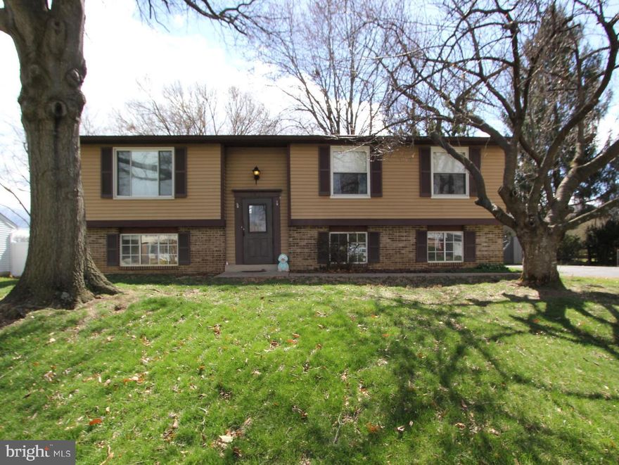 Fabulous five bedroom, three  bath detached home in a wonderful, close-in Walkersville neighborhood at a townhouse price!  This lovely property has been lovingly maintained by the original owners.   The main level features an updated kitchen with oak cabinets, updated appliances, tile backsplash and luxury plank vinyl (LVP) flooing.   The adjacent dining room is very spacious, with LVP flooring and sliding door access to the private rear deck.  The living room is light and bright and also has amazing LVP flooring.   There are three bedrooms upstairs, including a spacious primary bedroom with ensuite bath.  All of the upstairs bedrooms have newer carpet and ceiling fans.  Rounding out the upstairs is a convenient updated full hallway bath.  The finished lower level features a huge family room with brand new LVP floors , big windows and a ceiling fan.  There are two additional rooms downstairs, with large windows for sufficient egress, closets, new LVP floors and ceiling fans.  If five bedrooms aren't needed, either or both of these rooms would provide significant flexible space, and could be used as a convenient home office, den, etc.  There is also a third full bathroom downstairs, and a huge unfinished utility/storage room.   The lot features mature landscaping and beautiful trees, including a Cherry tree that will be in bloom soon!  The private raised rear deck overlooks the amazing backyard, which offers plenty of room to play.   This outstanding property has been freshly painted, is in move-in condition and is priced to sell now.  Hurry!