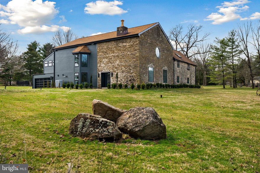 Unique and Extremely Rare Opportunity.

Don’t miss this once in a lifetime opportunity to own a beautifully preserved piece of history blended perfectly with modern style and sophistication. Early 1800 Historic Stone Barn with 6BR/4.5BA and 6,000+ sq.ft. is quietly nestled on a sprawling 2.13 acre lot located in prestigious Lower Gwynedd. The Captivating Custom Iron Gate welcomes you to the rustic stonework, Hardy Plank siding and contemporary glass garage door that provides hints of the unique style that lies within.

The grand custom made steel and glass Pivot Door draws you in, highlighting the original exposed 22” thick stone walls, soaring ceilings and open floor-plan. Enticing the senses, this home’s crisp and modern design features stained imported French white oak flooring throughout, Elegantly sweeping staircase, an expansive living room boasting a 32’ floor-to-ceiling stone fireplace and a built in library.

Adding to the ease of entertaining, the open concept chef’s kitchen features top-of-the-line Viking suite appliances, imported frame less black and white Italian cabinetry and oversized 14’ slab quartz waterfall island that seats 6 comfortably.

The primary suite stuns with vaulted ceilings, loft storage, panoramic windows and a fabulously chic en suite featuring a large double head rain shower and custom Italian floating vanity. All full bathrooms feature the same luxurious rain shower experience and custom built floating vanities. Ideal for guests, children, or lifestyle-specific flex spaces.

You get it all with this magnificent property! All the privacy of suburbia, with the convenience of quick access to major thoroughfares for the quick 30-mile commute to Downtown Philadelphia. Meanwhile, close to home are high-end shopping centers,  malls,  restaurants, multiple parks, golf courses, excellent schools, and so much more!

Call now to schedule your private and exclusive tour!