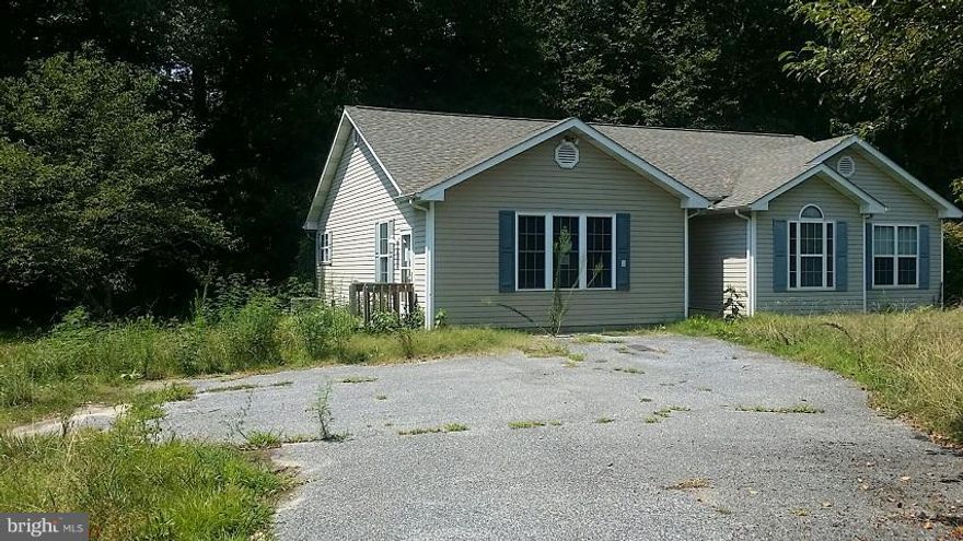 WOW!!! Lovely Rancher sits on almost 4 acres of land. Minutes away from Walmart and other stores, needs minor repairs but great buy for price.