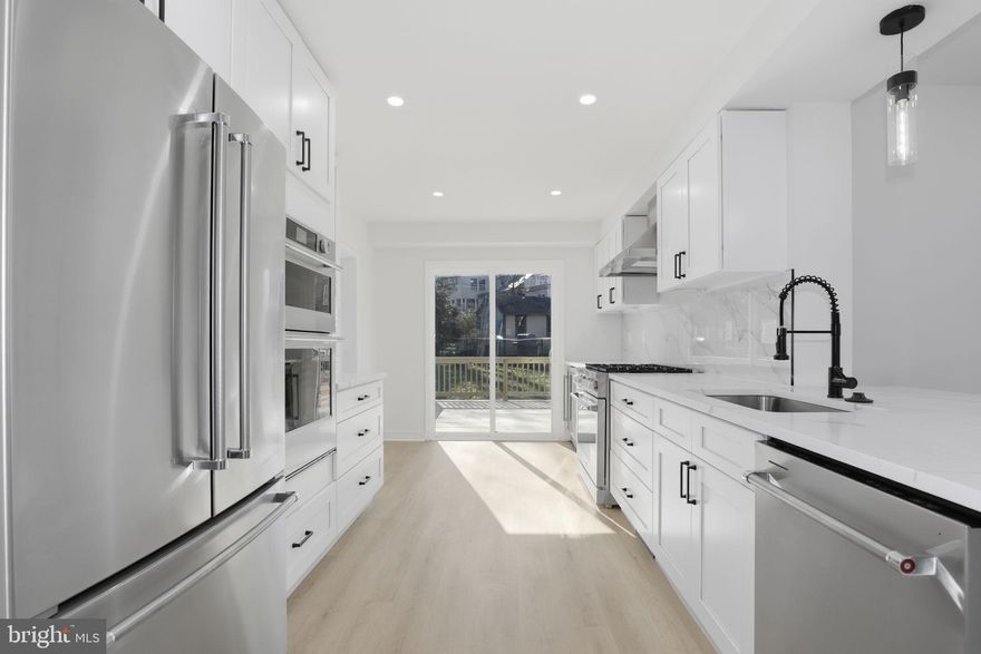 Top-to-bottom renovated three-level single-family home nestled in the highly desirable Seven Oaks neighborhood off Dale Drive—just steps to Sligo Creek Park and within walking distance to downtown Silver Spring’s shops, restaurants, and entertainment.

The main level features a spacious family room with a cozy fireplace, seamlessly open to the brand-new gourmet kitchen showcasing stainless steel appliances including wall oven-microwave combo, stove, range hood, refrigerator, dish washer and wine cooler , quartz countertops, upscale cabinetry, and a stunning waterfall quartz island. French glass doors lead to the new deck—perfect for indoor-outdoor living and entertaining. A formal dining room flows into the bright living room, creating an ideal layout for gatherings.

Upstairs, the primary suite offers a private, fully renovated bath with new tile, shower, vanity, toilet, fixtures, lighting, and mirror. Two additional generously sized bedrooms share a beautifully updated hallway bath featuring new tile, bathtub, vanity, toilet, fixtures, lighting, and mirror.

The fully finished lower level includes a fourth bedroom and a third full bath—completely renovated with new tile, bathtub, vanity, toilet, fixtures, lighting, and mirror. A large recreation room with windows and an exterior door provides abundant natural light and direct access to the backyard.

Major Updates Include: New flooring throughout; Fresh interior paint;  New lighting fixtures;  New roof; New hot water heater; New condenser, HVAC approximately 5 years old; Some brand-new windows and other windows approximately 9 years old; New deck; New concrete driveway with 4 parking spaces.

Located in a vibrant, walkable, and family-friendly neighborhood, this home offers easy access to nearby parks, shops, and restaurant. Just a short stroll to downtown Silver Spring, where you’ll find a wide variety of restaurants, entertainment, and retail options, including Whole Foods Market within walking distance. In the spring, take in the stunning cherry blossoms from the magnificent tree in the backyard—a truly special feature that enhances the charm of this wonderful community.