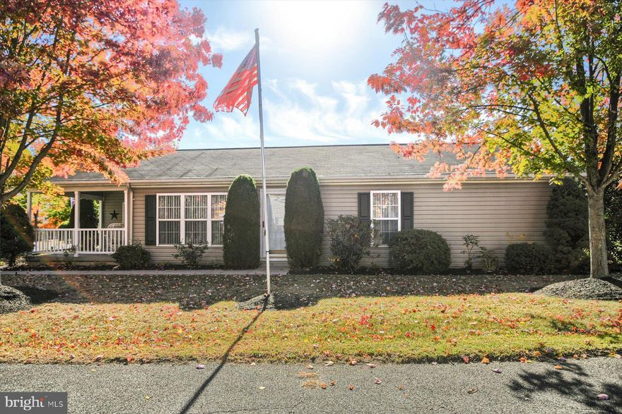 Welcome to the popular Village of Neshaminy Falls, a vibrant 55+ community offering a welcoming clubhouse and an array of amenities and neighborhood activities.  One of the few homes bordering William F Maule Park and its beautiful woods. This beautifully landscaped and meticulously maintained 2-bedroom, 2-bath home is a perfect blend of comfort and style.  Step into a bright, airy living area featuring vaulted ceilings, leading to a separate dining room and a spacious kitchen with ample cabinet and counter space. The convenient laundry room includes a large laundry tub and washer and dryer. The primary bedroom boasts an ensuite bath with a walk-in shower and a walk-in closet, while the cozy sunroom opens to a covered Trex deck, ideal for relaxing.  In addition, a  large patio with neutral pavers lines the side of this home where you can grill and share outdoor meals, with easy access through the laundry room entrance. Outdoor shed for additional  storage. New heat pump/AC (2023) Monthly fee includes membership to Clubhouse and Pool! Perfect time to buy and be in your new home for the holidays!