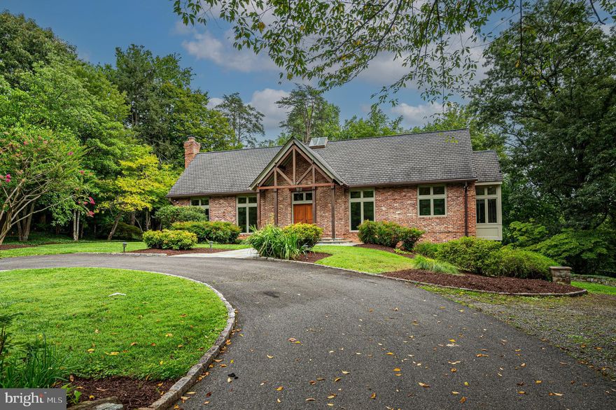 OFFER DEADLINE IS SUNDAY AT 3:00PM. Vermont Retreat nestled in 1-acre private setting!! Welcome to this beautifully renovated home with vaulted beamed wood in the living room, dining room and kitchen.  Cathedral ceilings provide an abundance of light. The large living room features a stone- faced wood burning fireplace, six windows and 2 French doors. The chef’s kitchen with stainless steel appliances features an 8 windowed breakfast area with a chandelier.  French doors from the kitchen access a deck with stairs to a flagstone patio. A large den/office with wood burning fireplace features built in bookcases and desk. There are two bedrooms and two full bathrooms on the main level. In the walk out basement level, there are two large windows in the rec room plus a door that leads to the patio. There are two additional bedrooms, a full bathroom, wet bar and laundry room on this level as well as a third wood burning fireplace.  Conveniently located: 1 mile to GW Parkway, 2 miles to D.C, 5 miles to Tysons Corner, 9 miles to Reagan National Airport.