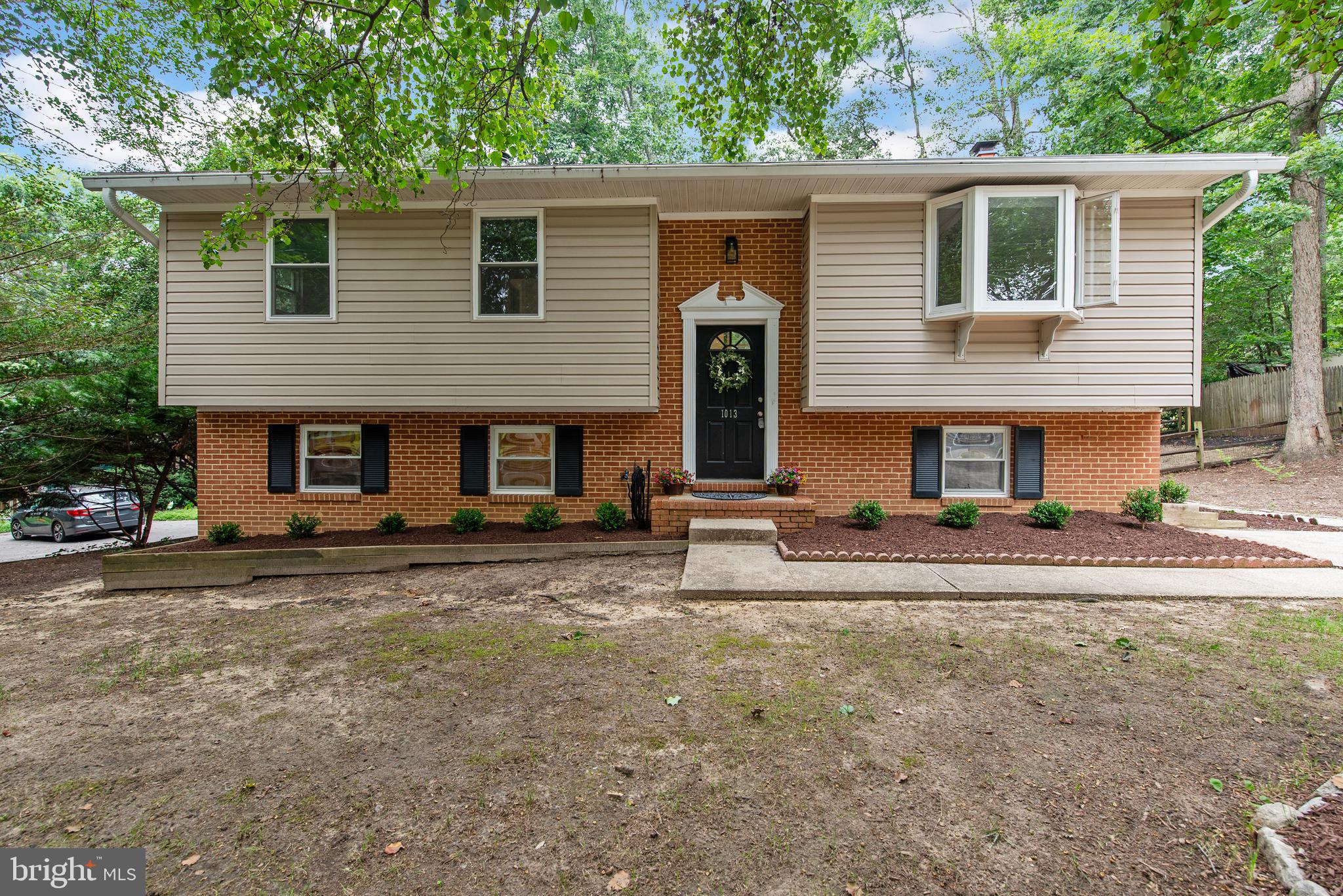 Welcome to Arden on the Severn! Just steps from the water (approx. 700 feet), this spacious 4-bedroom, 2.5-bath split foyer home offers the best of this sought-after waterfront community. Located in Section 4, enjoy exclusive access to private beaches, boat ramps, and more. The open main level features a bright living room, dining area, and updated kitchen with island — plus a sliding glass door to a large deck overlooking the fully fenced backyard. Upstairs offers three bedrooms and 1.5 baths, including a half bath in the primary bedroom. The walk-out lower level includes a second living area, full bath, fourth bedroom, and a bonus room perfect for storage, workshop, or fitness space — with access to the backyard. Masonry firepit, and pool table can convey! Now districted to the brand-new Severn Run High School. Enjoy the beach lifestyle just minutes from major routes, Fort Meade, Annapolis, and Baltimore/DC.
