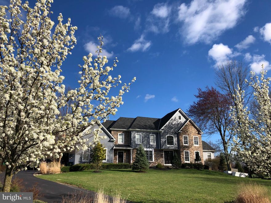Premium location  backing to a partially wooded backdrop on a calm Cul de sac street in the highly desirable Pickering Chase subdivision, moments away from Newtown Borough. Carefully upgraded Stone and sided Colonial with an open floor plan.  Inside the two story foyer opens to the turned staircase, formal living and dining rooms garnished with tray ceilings. The centerpiece of the home is the stylish gourmet eat-in kitchen  with beautiful designer counters and backsplash, "Wolf" Range , separate wall ovens, "Sub-Zero" refrigeration, center island all open to the breakfast room and two story family room with stone floor to ceiling wood burning fireplace. An office study, powder room, conservatory with cathedral ceiling and mud room complete the main level. The second floor is accessed via  one of two staircases. A spacious second floor landing opens to both the foyer and family room. The opulent master suite with tray ceilings  was designed with two full bathrooms, a sitting room, full laundry and  luxurious walk-in closets. Bedroom two " en suite" along bedrooms three and four which are dived by another full bathroom complete the second level. The finished lower level with walk-up egress has multiple entertainment and media rooms including a wine room, full bath, 2nd laundry and optional bedroom. Outside off of the kitchen was designed with no compromises. A luxurious deck complete with 'Fire Magic"  refrigeration, grill and cooking station,  cathedral ceilings which opens to a  privacy backyard with swimming  pool, hot tub and completely fenced  professionally landscaped yard.
Additional  upgrades  which include, Home generator,  central vacuum, new central alarm and fire detection,  new roof and  new HVAC servicing the second level are included on the Sellers Disclosure.