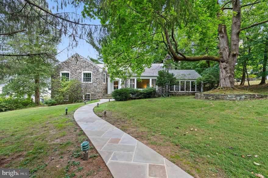 Welcome to this classic "Mahoney" built gem, just waiting for the new owners to make it shine!  This home is on Beech Hill Road, one of the most coveted picturesque streets in Northside Wynnewood. Situated in the award winning Lower Merion School District, this home has the best of everything!  It is a 3 bedroom Cape Colonial, situated on a very large .48 acre lot. Pull in the long, private driveway and immediately admire this gorgeous beautifully appointed stone home!  Enter the front door from a meandering flagstone walkway.  To the right of the light filled foyer, is an extra large living room complete with a beautiful mantle and gas fireplace.  Off of the living room is a sunroom/enclosed porch, perfect for a playroom, family room or home office.  The formal dining room has a picturesque window overlooking the backyard grounds. The eat in kitchen offers a door into the dining room , and also offers rear entry to the driveway.  The 2nd floor includes an extra large primary bedroom with a private ensuite bathroom.  On this level is also another bedroom and a full hall bathroom.  Go up a few more steps to a 3rd large bedroom and another full bathroom. This home boasts beaming hardwood floors throughout!  The attic area is unfinished, but certainly has potential to be finished off as another bedroom or playroom.  The laundry area is located in the large unfinished basement with and half bathroom, which also has wonderful potential for additional finished space.  The basement leads you directly to the 2 car attached garage.  In the rear of the garage, there is an added bonus room, complete with a closet, windows, and another full bathroom!  This could serve as an office, an in-law suite or workout room. While on a quiet, pristine street tucked away in a beautiful neighborhood, this home is also located in an ultra convenient location!  It is just a little over a mile walk to Suburban Square Shopping Center featuring Trader Joe's, Lifetime Fitness, popular restaurants and much more!  This location is also just a little over a mile to 2 different SEPTA stations for a short ride to Center City, and one of these stations (Ardmore) takes you directly to NYC.  Being sold in "as is" condition, bring your vision and dreams - and do not miss this incredible opportunity!