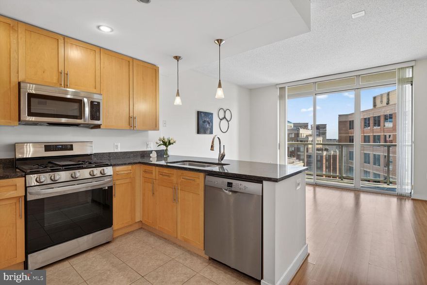 Welcome to your new home!  Beautiful 1 Bedroom, 1 Bath condo just waiting for you – move in ready.  Clean updated fresh paint. Wonderful - Walkability to shops and lots of restaurants galore to savor and enjoy.  Open floor plan with Gourmet Kitchen w/Granite Countertop & brand New stainless steel appliances,  lots of natural sunlight & great view.  Separate area for dining room table as well as countertop kitchen counter space.  Bamboo laminate floors in foyer/living/dining area & ceramic tile in kitchen & bathroom for easy care, fresh neutral paint.  Open floor plan to inviting living room area with large private balcony to enjoy fresh air from the 8th floor overlooking Ballston. Large bedroom with lots of natural light & adjacent bathroom with large tub/shower combo & 2 spacious bedroom closets. Stacked Washer & Dryer in unit and  separate coat closet for extra storage by entrance. Utilities - gas, water & trash included in condo fee,  just set up as new owner electricity & internet services. Condo comes with 1 Gar Parking garage inside bldg & privileges to exercise room & indoor bike cage, Ballston shops/restaurants/services & two metro stops close by. Extra storage cages available inside bldg available for rent.  Visitor parking can be obtained with reservations with condo manager office or  there is plenty of metered street parking available. Well maintained building with secure controlled secure  bldg access and lots more to enjoy in the Ballston neighborhood. Building amenities include a fitness center, private courtyard, and business center in lobby of condo building. Conveniently situated just three blocks to either the Ballston and Virginia Square Metro stations, the condo is just moments from restaurants, shops, and entertainment.  close to many Yelp’s Top 25 Best New Restaurants in the country. Enjoy quick and easy access to Washington, D.C. via I-66, as well as other major highways. With its prime location and modern conveniences, this condo is perfect for anyone seeking a vibrant urban lifestyle & walkability in one of Arlington's most desirable neighborhoods and awesome views from 8th floor private balcony.  come check out and see your new home.