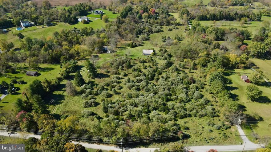 Whether you choose to renovate the existing home or design and build your own custom estate, the land provides a serene and flexible canvas for your vision. With no HOA and AR-1 zoning, this privately sited property offers a lot of options. Equestrian enthusiasts will love the freedom to bring horses and create their ideal setup, from stables to riding trails, with plenty of space to roam. The property’s peaceful, rural setting provides privacy and scenic views, making it the perfect spot for those seeking a countryside retreat. Despite the tranquil surroundings, you're still just minutes away from Lovettsville’s town center, local vineyards, parks, and other amenities. With 11.7 acres of unrestricted land and no HOA dues, this property invites you to create your dream home in a picturesque Northern Virginia location. Whether you're looking for a weekend getaway or a full-time residence, this property is your blank canvas for an idyllic lifestyle!