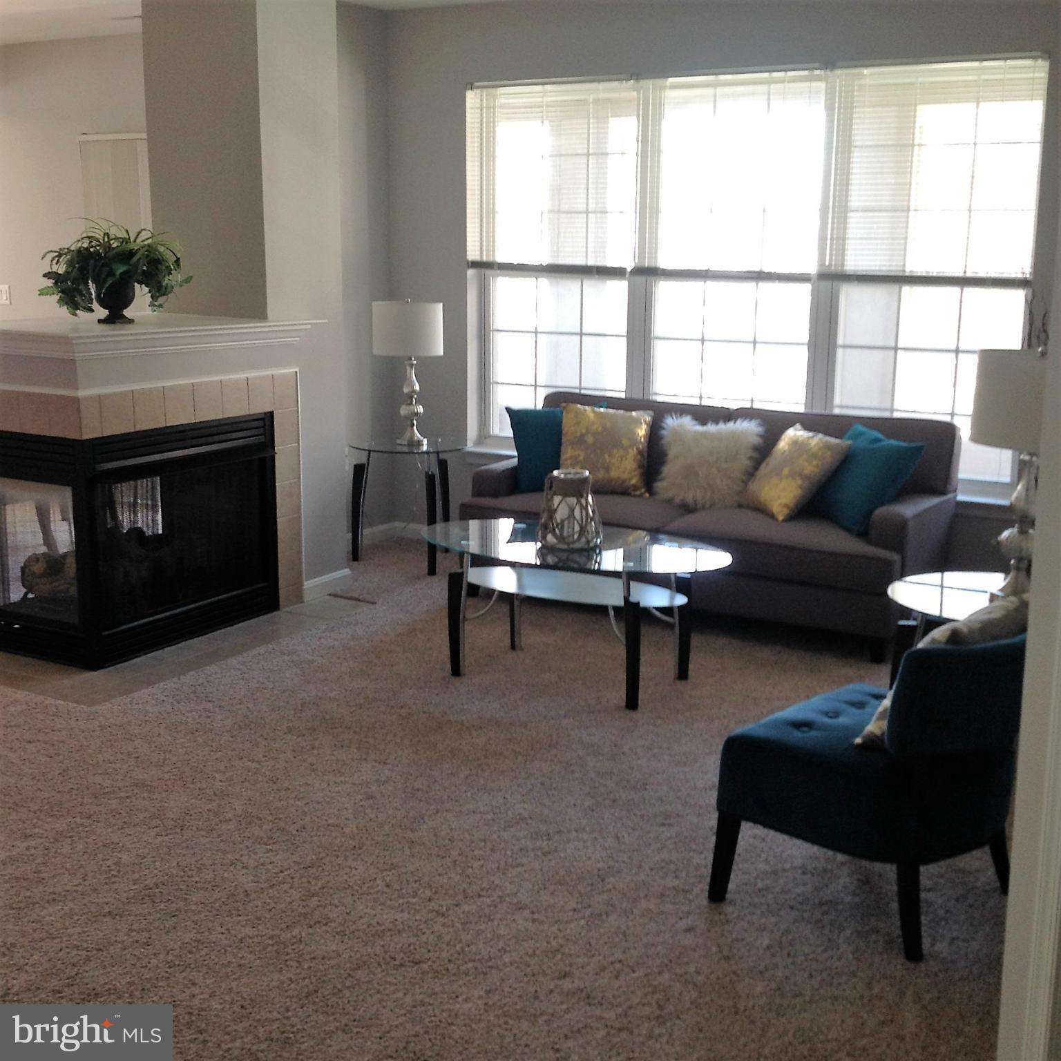 NEW PRICE! Rarely available 3BR/2BA unit in prestigious community. 1600+ sq ft of gracious living. LR room and DR share 2-sided FP. Covered balcony, handsome kitchen & breakfast room. Lrg MBR has attached sitting room/office & ensuite. Fresh paint,new carpet & SS appliances. Bldg boasts coffee bar, library, sitting room, fitness center, tennis courts and pool. 2 garage prkg spaces.