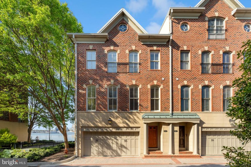 Live authentically. If you’re looking for one-of-a-kind waterfront, this is it. The only fully custom home in desirable North Shore. Purchased directly from the developer during framing and fully reimagined with a totally unique floor plan and top of the line materials. Step inside and instantly fall in love. Stunning custom walnut staircase greets you as you enter. A few more steps and your eyes will be wowed by the expansive views of sparkling water. Spacious ground-level en-suite bedroom with custom built-ins is flanked with a wall of glass that stretches the entire width of house and walks directly out to the promenade. Step upstairs to a sophisticated space anchored with intentional design. This main level offers a unique layout with the perfect blend of defined spaces and seamless flow. Designed to live like a true home, this middle floor offers two living and dining spaces, both formal and casual, two fireplaces, a powder room and three walls of glass. 
The glistening 7” wide walnut plank floors are unlike anything you’ve seen in North Shore and are the perfect compliment to the custom crisp white plantation shutters and window treatments throughout home. Gorgeous eat-in kitchen with top of the line appliances and an elevated casual dining nook with the very best view. Step up one more level to a peaceful third floor reminiscent of a boutique hotel. Two gorgeous en-suite bedrooms and spacious laundry room. The primary is flooded in natural light with a balcony overlooking an unmatched view of the water. As one of only 12 houses on the Baltimore waterfront with breathtaking open water views that will never be developed, you can rest assured that what you see is what you get, forever. This home is incredibly maintained from top to bottom with all new Marvin Ultimate sliders and windows recently installed on the water side of property. Cultivate your existence. The art of uniting human and home.
