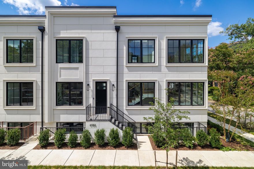 Designed with flexibility and high-end comfort in mind, this stunning residence offers over 3,000 square feet of thoughtfully crafted living space to suit a variety of lifestyles. Located just one block east of Wisconsin Avenue and a half block from Trader Joe’s, you’ll enjoy unbeatable walkability to all the dining, shopping, and entertainment options downtown Bethesda has to offer.

Inside, the home features 4 spacious bedrooms, 4 full baths, and 1 elegant powder room. The open-concept layout is enhanced by wide-plank white oak flooring, soaring ceilings, and expansive windows that fill the home with natural light. The gourmet kitchen is outfitted with top-of-the-line Thermador appliances, custom Italian cabinetry, and stunning quartzite countertops with a waterfall edge.

The luxurious primary suite includes a spa-like bathroom with heated floors for ultimate comfort. A large private terrace provides an ideal space for outdoor entertaining or relaxation, while the two-car garage offers added convenience.

The lower level is perfect for hosting guests, offering a separate entrance for added privacy and flexibility.

With customizable finishes and thoughtful design throughout, this home delivers a rare blend of sophistication, comfort, and location.