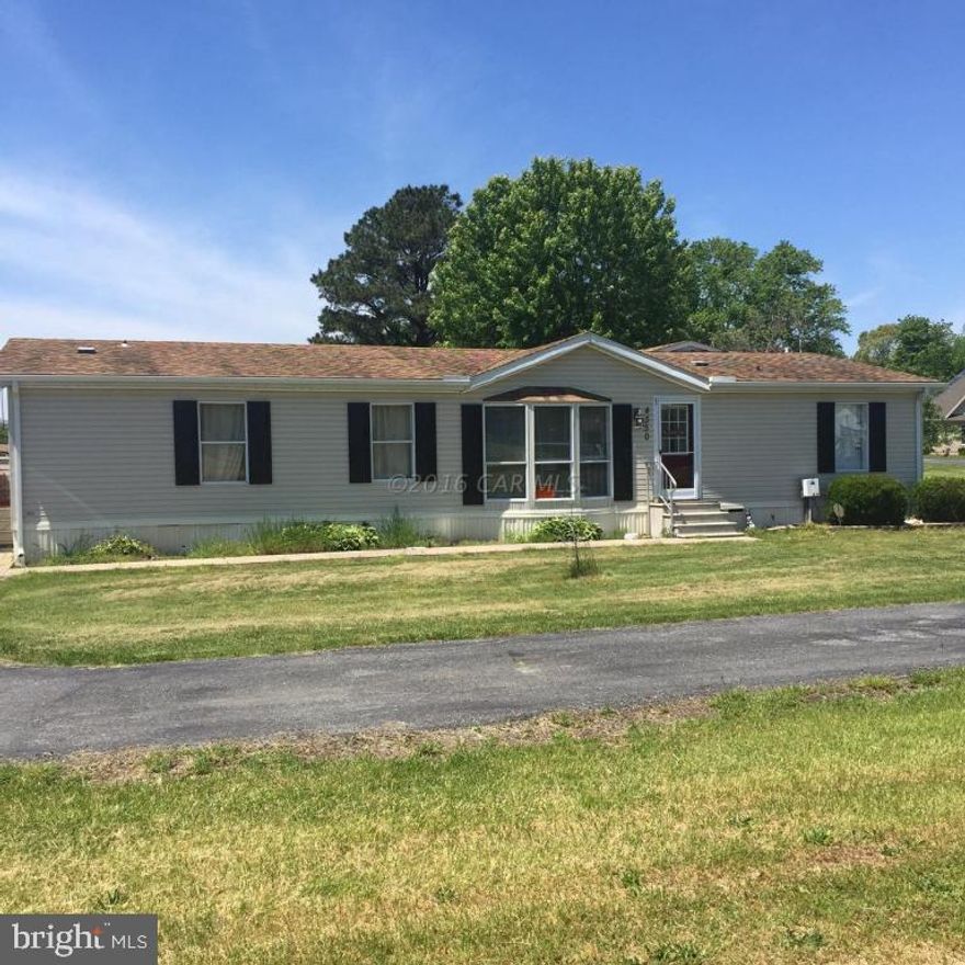 Over one acre of peace and quiet in the country. Low maintenance double wide offers a lot of space for a little price. Large addition was just added 3 years ago features master suite fit for a king with french doors, lots of natural light, huge bathroom with Jacuzzi tub. Outside is an above ground pool with decking, a carport and shed. Convenient to Snow Hill, Wallops Island or Ocean City this property is sure to please anyone looking for an affordable getaway.Upgrades include 200 amp. service, whole house water treatment system, BAT nitrogen removal septic system, heat pump is 3 years old. Master bedroom addition is 3 years old. Gorgeous blacktop paved driveway leads you back to this private retreat in the country!