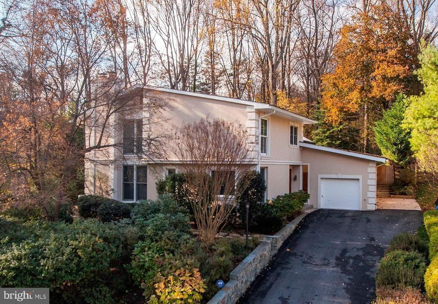 10610 Great Arbor Drive is a well-appointed and beautifully designed Contemporary home with 4 Bedrooms and 3.5 Baths throughout approximately 3,174 square feet. This special home captures your attention and showcases a number of landmark Mid-Century Modern features including large rear windows, changes in elevation, and a wonderful integration with nature. This home rests on just under a quarter acre of landscaped grounds and is graced with a backyard oasis unlike any other. An expansive rear Deck spans nearly the entire length of the home and includes a Pergola that highlights the Hot Tub area. A Built-in Grill is a luxury that makes for easy outdoor entertaining. The spectacular Main Level is distinguished by its soaring A-frame windows that harmonize the Living and Dining Rooms with an impeccable rear Deck and sweeping views of the backyard. Open and flexible, the Living and Dining Room blend together and flow into the gourmet Kitchen which is complete with custom cherry wood cabinets, stainless steel appliances, and gleaming granite countertops. The Uppermost Level has 3 Bedrooms including a Master Suite with a spacious walk-in closet and a spa-like Bath. The relaxing Master Bath is comprised of a dual vanity with granite counter, a separate shower, oversized soaking tub, and a skylight. Bedrooms #2 and #3 share an updated Hall Bath with a jetted tub/shower.  A warm and inviting Family Room with a wood-burning Fireplace is on the Entry Level and is adorned with a wall of built-in bookcases. The Entry Level also has a 4th Bedroom/Office, a Powder Room, and access to the Garage. The Lower Level features a comfortable Recreation Room, a private Guest Room with an En-Suite Bath, a Laundry Room, and a Utility Room.