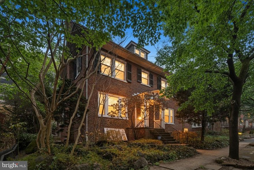 Classic Baltimore architecture meets thoughtful modern updates in this beautifully maintained end-of-group home offering space, character, and rare conveniences.

Step inside to discover soaring ceilings, oversized windows, and original hardwood floors that immediately set the tone. A gracious entry hall opens to expansive living and dining spaces anchored by a fireplace and framed by elegant architectural details. Just off the main living area, a charming library lined with built-in shelving creates the perfect home office, reading room, or creative retreat.

The renovated kitchen combines style and function with updated appliances, custom cabinetry, and distinctive finishes. From here, a bright sunroom overlooks the garden and provides a peaceful spot for morning coffee or relaxed evenings at home.

Upstairs, generously sized bedrooms and beautifully updated bathrooms continue the home’s theme of light, space, and timeless design. A finished third-floor bonus space offers incredible flexibility as a studio, guest area, office, or hobby room.

The lower level provides laundry, abundant storage, workshop space, and convenient interior access to the attached garage.

Outside, a private garden and patio create a welcoming outdoor retreat, while the attached garage and driveway provide highly sought-after off-street parking.

Major updates include HVAC (2020), replacement windows (2021), updated kitchen appliances (2024), and multiple interior improvements.

Ideally located near Johns Hopkins Homewood campus, Sherwood Gardens, and Calvert School, this home offers a rare combination of historic character, generous living space, and exceptional convenience.