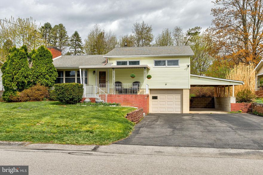 OPEN HOUSE - Sunday, April 19th, 11:00 AM - 12:30 PM.  Welcome to "The Hill" in Boalsburg! This beautifully maintained multi-level home is ideally situated on a .20-acre lot. Enjoy gleaming hardwood floors throughout the spacious living room, dining room, hallway, and all three bedrooms. The remodeled kitchen features granite countertops, modern appliances, and sliding doors that open to a large, covered deck—perfect for entertaining—which leads to a fantastic, level backyard. The finished lower level offers a versatile rec room and laundry area, plus a one-car garage and an additional carport. Relax on the inviting covered front porch, an ideal spot to enjoy your morning coffee or read a book. Don’t miss the opportunity to own this wonderful home!