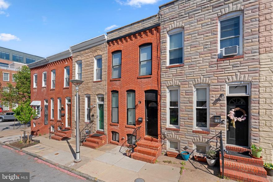 Bonus room in lower level can be used as 3rd bedroom! Nestled in the heart of the historic Federal Hill District, this exquisite interior row townhouse seamlessly blends classic charm with modern luxury. Renovated and meticulously maintained, this home showcases a stunning Federal architectural style that invites you to experience a lifestyle of elegance and comfort. Step inside to discover a warm and inviting atmosphere and an open floor plan with ample natural light that effortlessly connects the living and kitchen areas. Recessed lighting casts a soft glow throughout, enhancing the beauty of the space while providing a cozy ambiance for gatherings or quiet evenings at home. The combination dining/living area is perfect for entertaining, while the breakfast nook offers a delightful spot for morning coffee or casual meals. The heart of the home is the gourmet kitchen, equipped with high-end appliances including a gas oven/range, built-in microwave, and dishwasher, ensuring that culinary adventures are both enjoyable and efficient. The thoughtful layout includes ample counter space and storage, making it a dream for any home chef. Half bath on main level perfect for guests and visitors. Retreat to the one of the two large bedrooms, where you can unwind in your beautifully appointed bathrooms with dual vanities. With a total of two full bathrooms and one half-bath, convenience and comfort are paramount. The property features two spacious bedrooms with a bonus room that has been used as a third bedroom, each designed to provide a peaceful sanctuary. Natural light pours in through insulated windows, creating a bright and airy feel throughout the home. The lower level laundry area, complete with washer and new ventless dryer, adds to the ease of daily living. Outside, the backyard space is lined with a privacy fence. Enjoy the proximity to local parks, stadiums, boutique shops, and fine dining, all within walking distance, allowing you to fully embrace the exclusive lifestyle that Federal Hill has to offer. With a total finished area of 1,353 square feet, this townhouse is not just a home; it's a lifestyle choice that embodies comfort, elegance, and the charm of historic living. Experience the perfect blend of modern amenities and timeless character in this remarkable property.