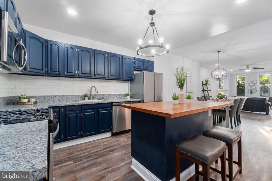 Welcome to 415 N Patterson Park Ave. where you will find a new construction feel with nostalgic Baltimore rowhome charm. With all brand new flooring, fixtures, electrical, plumbing and all brand new internal systems and appliances one will feel immersed in excellence and fine living. Enter through the front door into the living room that is open to the dining room and kitchen. The large windows on the front of the home give tons of natural light and the tree right out front  makes the living room area that much more cozy with a sense of privacy. The kitchen is massive with tones of cabinetry and counter space including the  large butchers block island. The kitchen  connects to a sizable laundry room on the back of the home where you will find a powder room offering convenience to the main level. There is a detached garage so that one can park their car out of the weather. On top of the garage there is an outdoor living space with a green garden where one can enjoy a peaceful outdoor living. The second level has an owners suite with an oversized owners suite bathroom and a second bedroom toward the back of the home with another full bathroom that is accessed from the hall. All three bedrooms in this home are very large and spacious. The basement level bedroom has an en-suite full bathroom and massive closet with bonus office area or work out area with a window giving natural light to the basement level.  There is also a very large extra room in the basement that can be used for tons of storage. This home is located right beside Johns Hopkins School of Medicine and is a short distance away from the Target/ Harris Teeter Shopping Center, Whole Foods Downtown, and Canton and Fells Point Water Front.  I say "like new construction" because all of the electrical, plumbing, and entire HVAC, and ductwork is all brand new. Washer, dryer, stove, microwave, fridge, and dishwater are included and brand new.