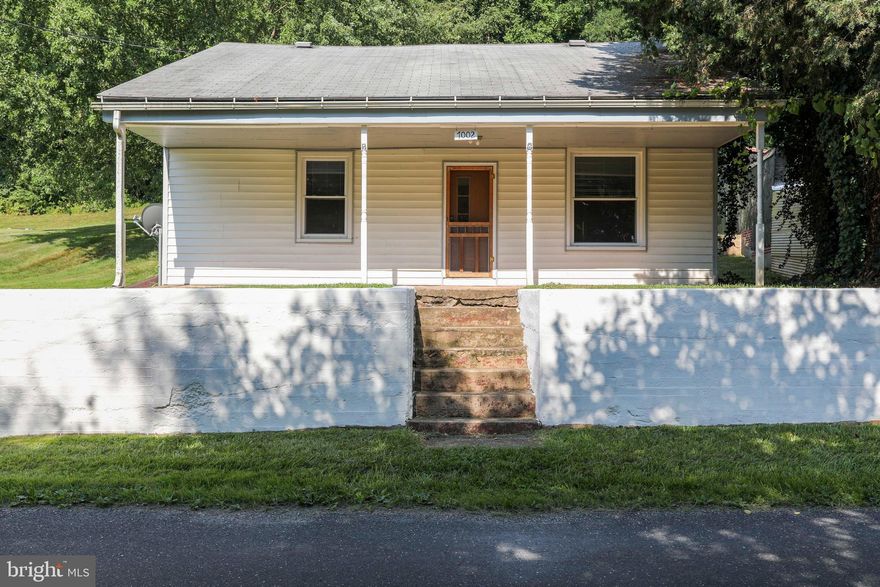 Welcome  to this RARE FIND in Frederick County!  A three bedroom, one and a half bath, country home in Middletown, on over an acre less than $300k! This home features a front porch with picturesque views, a mud room, full and unfinished basement, three bedrooms upstairs, hardwood floors and a pellet stove in the dining room. With a little TLC and your personal touch this home is ready for you to make your own. With some sweat equity and a little elbow grease this home is ready to be brought back to life. Enjoy a large quiet back yard that backs to state land with views for days. Schedule your private tour today before it's too late!