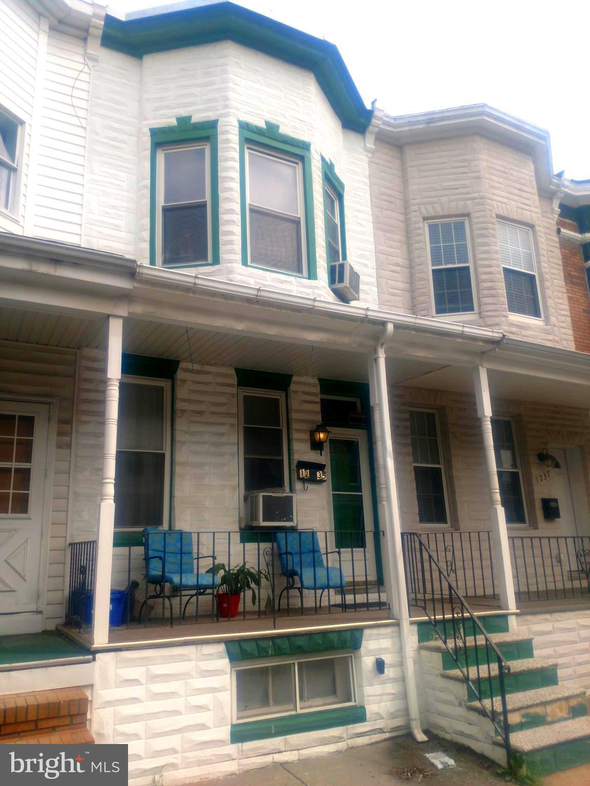 Terrific opportunity in Washington Village! Sold as-is yet this very solid, wide home sports a large front porch, open concept first floor with staircase along the side, a second floor office/walk-in closet, easy opportunity for off-street parking, full basement with good ceiling height. Attractive block in a quiet location. Bring your vision and see the potential!