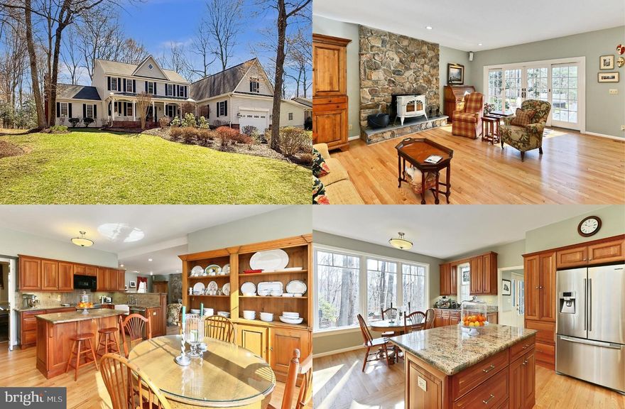 Nestled on a serene 2.01 wooded acres for ultimate privacy in the sought-after Cannon Bluff community, this gorgeous 6 bedroom, 3.5 bath custom colonial with a 1,700 sq. ft. addition by Mike Garcia delivers 4,784 square feet of living space on 2 levels and upgrades galore! The beauty begins outside with a tailored exterior with charming front porch, oversized driveway, 2-car garage, expert landscaping with stone planting beds, multi-area Pennsylvania Blue Stone patio and walkways, large deck, garden shed, playhouse, and lush yard overlooking majestic woodlands. Inside, an open floor plan, gleaming hardwood floors, decorative moldings, custom woodwork and built-ins, a stone fireplace, and an abundance of windows that create a light and airy atmosphere are just a few features that make this home so special. An upgraded kitchen and updated baths, luxurious owner’s suite, and fabulous recreation room with a custom wet bar and pool table that conveys create instant appeal. This home has been lovingly and well maintained for 32 years and with upgrades such as Anderson windows, a newer 40 year architectural shingle roof with metal seam roof over the front porch, gutters, and major systems updated or replaced this home is move in ready, all that awaits is you! **** An elegant foyer with dentil crown molding and wainscoting welcomes you home as warm hardwood flooring ushers you into the living room on the right where twin windows stream natural light that illuminates soft neutral designer paint and crisp decorative moldings. Opposite, the formal dining room echoes these details and is accented by a candelabra chandelier adding a refined style. The gourmet kitchen is sure to please the modern chef with gleaming granite countertops and backsplashes, an abundance of 42” raised paneled wood cabinetry, a farmhouse sink, and sleek stainless steel appliances including a slide-in smooth top range. Enjoy daily dining in the breakfast room featuring a built-in serving buffet and a wall of windows providing beautiful outdoor views. The sunken family room with a wall of built-in bookcases invites you to relax in front of a floor to ceiling stacked stone wall with a Vermont Castings Encore woodstove. Here, a double paned sliding glass door grants access to the spectacular multi-area stone patio and the grassy backyard with a large deck, garden shed and playhouse, all surrounded by majestic woodlands providing a perfect outdoor oasis for entertaining, nature watching, and relaxation. Back inside, a library with built-in bookcases makes an ideal home office, a spacious recreation room featuring a pool table, and a custom granite topped wet bar with beverage chillers is sure to be a popular destination, and a powder room and mudroom with cabinets and sink complement the main level. **** Hardwood flooring continues upstairs and into the light filled the owner’s suite boasting a ceiling fan and dual cedar lined walk-in closets. The luxuriously upgraded ensuite bath features a soaring cathedral ceiling with skylight, a dual sink vanity and separate dressing vanity, sumptuous soaking tub, and glass enclosed shower, the finest in personal pampering. Down the hall, a junior suite with hardwood flooring and a lighted ceiling fan enjoys a private bath, and 4 additional bright and cheerful bedrooms, each with hardwood flooring and lighted ceiling fans, share access to the well-appointed hall bath. **** All this in a tranquil mid-county community located in the Colgan High School District, and where the backyard includes a creek and trail that leads to the dock and ramp of a private 12.5 acre park with Occoquan River access. Launch a small engine boat, canoe, or kayak, enjoy fishing, the picnic area, the nature trails. Commuters will appreciate the easy access to Prince William Parkway, Route 234, Horner Road and Tackett’s Mill commuter lots and the VRE. There is abundance of shopping, dining, and entertainment choices in every direction!