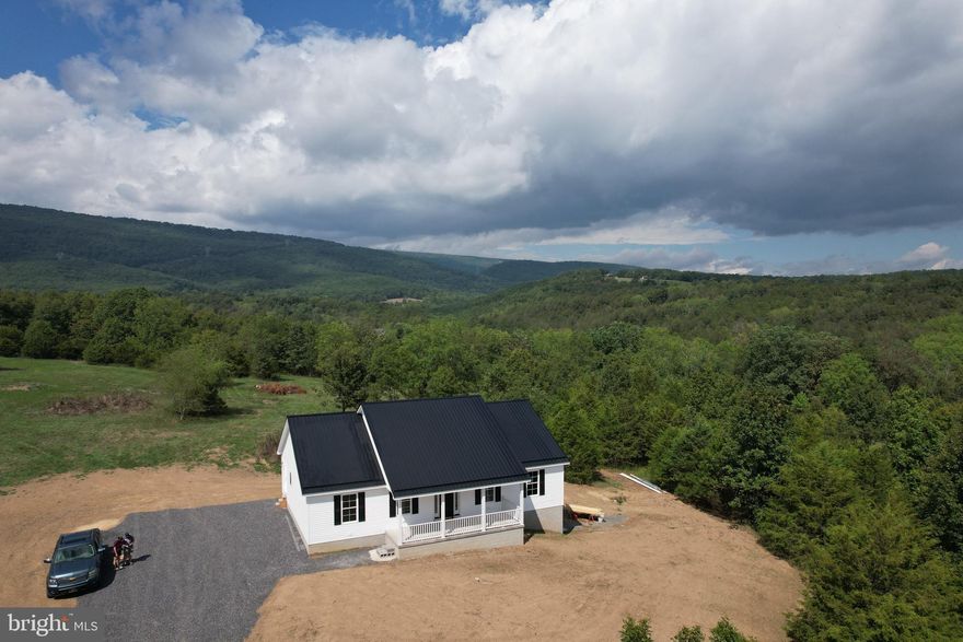 NEW BUILD in the Quantico Estates Subdivision. This 3 bedroom, 2 bath home sits on a spacious private 5.15 acres with scenic mountain views and the peaceful sound of nature. This home has an open floor plan with that "modern farmhouse" feel.   It boasts a modern kitchen, granite countertops, GE stainless steel appliances, soft closing cabinet drawers, recessed lighting, and 8 ft. ceilings. Walk out basement can easily be finished and is already plumbed for another bathroom. Builder will also complete the rest of the fine details such as concrete stairs, lights, exterior outlets, plant grass seed...etc before closing. Work from home? Need internet? No problem. StarLink Satellite internet is available.  If you "need to" leave home, town is a short 10-15 minute drive away to the local hospital, restaurants, grocery store, and shops. Also within a short drive you can enjoy activities such as hiking, fishing, hunting, and camping at Blackwater Falls, Seneca Rocks, Smoke Hole Caverns,  Dolly Sods..etc. Only two and a half hours from Washington D.C. Call for a showing of  your "Peace of Heaven" today.