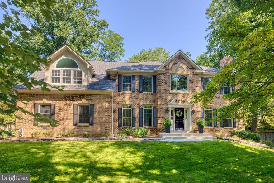 Fabulous upgraded all-brick cul-de-sac home on nearly an acre in beautiful and convenient Oakton!!!  Three wonderful levels including remodeled gourmet kitchen with stainless steel appliances and granite counters.   Large island with five-burner gas cooking and pendant lighting.  Extra cabinetry with glass doors, designer rectangular backsplash and recessed lighting.  Breakfast area and family room both have French doors to four-season all-glass sunroom.   Vaulted ceilings in family room with stone floor-to-ceiling wood-burning fireplace with gas insert.   Tucked-away main level library with built-in shelving.   What a welcoming walkway and entry foyer with wood staircase and runner.   Hardwood floors on upper two levels, dental moldings, chair rails and palladium windows!!!   Terrific primary suite with sitting room, vaulted ceilings and just remodeled primary bath.  Sumptuous Ove Decors soaking  tub and separate shower with frameless glass.   Custom back-lit mirrors over dual sinks.   Great secondary bedrooms with wood floors and two additional full baths.  Awesome walk-out lower level with recreation room with French doors to covered patio.   Rec room has a wood-burning brick fireplace and wet bar with full-size refrigerator.  Fifth bedroom and gorgeous upgraded fourth full bath perfect for an in-law or nanny suite.   Private deck overlooking manicured rear yard with paver patio, flower beds and large fenced flat yard.   Valewoods connects to neighboring communities for great long walks or even a hike up the Cross County Trail.    Convenient to shops and restaurants, the Town of Vienna, Tyson's Corner, I-66, the Beltway, Washington, D.C. and the entire technology corridor.