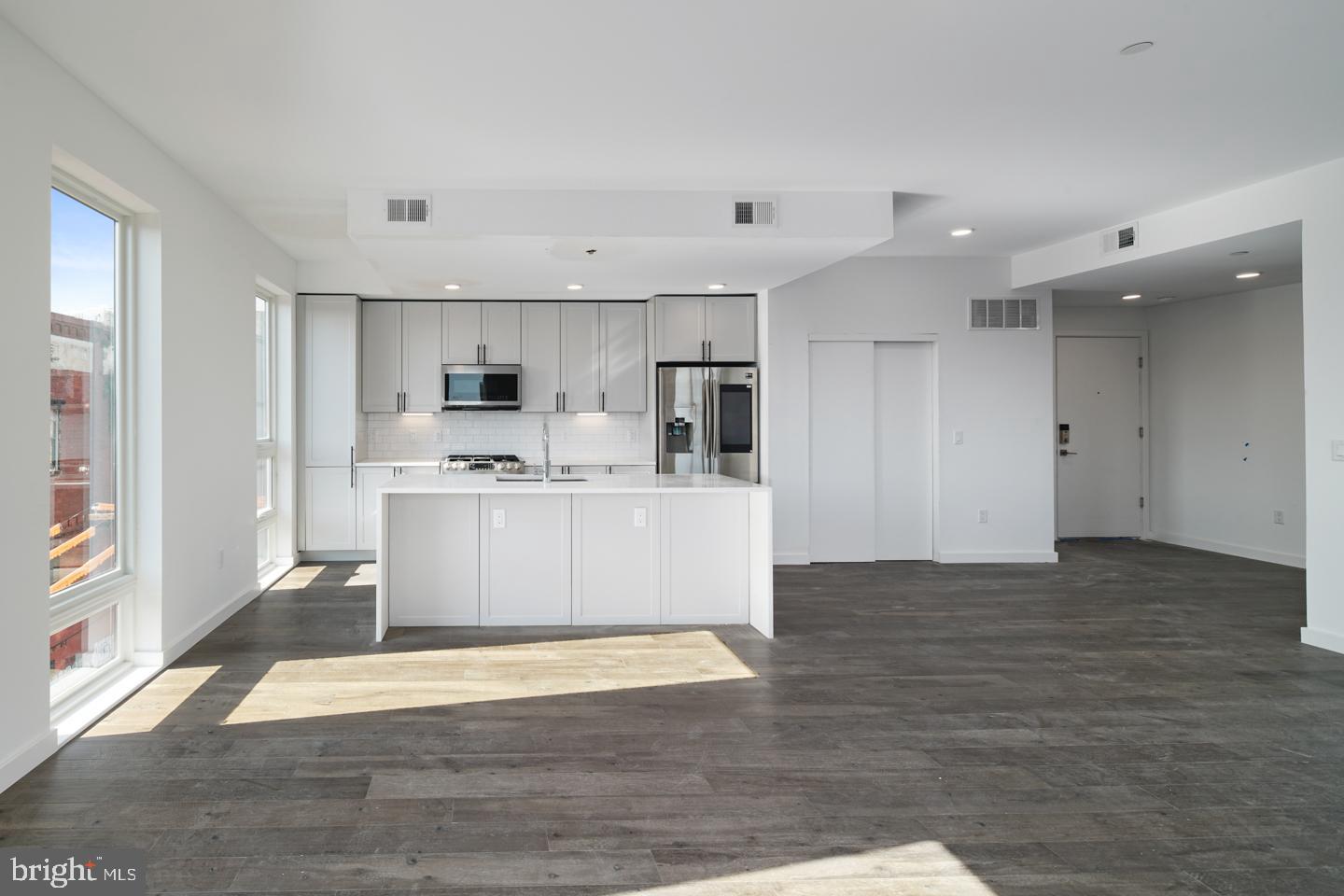 This property qualifies for a 1% INTEREST RATE BUY DOWN for the 1st year at ZERO cost when using the preferred lender! Welcome to Otto on the Park, a sophisticated collection of contemporary condos offering the convenience of parking and more. Enjoy a tax abatement through 2032! Amidst a burgeoning neighborhood, this unit boasts a private balcony and a shared roof deck with breathtaking skyline views. The open floor plan features hardwood floors, soaring ceilings, and abundant natural light throughout. The spacious living area includes large windows, recessed lighting, and ample space for an entertainment setup. A dining area with balcony access compliments the chef-style kitchen equipped with white cabinetry, a generously sized island with breakfast bar, subway tile backsplash, and stainless steel appliances. The unit offers three well-appointed bedrooms with ample closet space. Both graciously sized bathrooms are elegantly designed with beautiful finishes. Additional highlights include in-unit laundry facilities and convenient storage space. Residents can enjoy a communal roof deck featuring a kitchenette, grill, skyline panoramas, dog run, and room for gatherings. Nearby amenities include Revival Brothers Coffee across the street, as well as proximity to Fairmount attractions such as the Schuylkill River Trail, Boathouse Row, and the Philadelphia Zoo. Taxes & square footage are the buyer's responsibility to verify independently. Photos are for marketing purposes only and may not portray actual finishes/be from another unit. Inquire with the listing team for more details. The PAR Standard Agreement of Sale for New Construction must be used for new construction properties, whether completed or not.