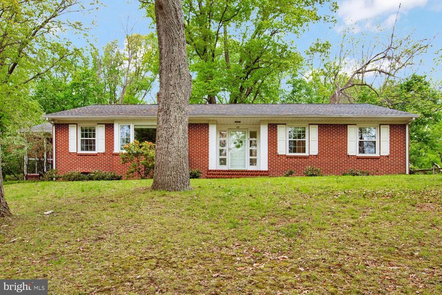 Welcome to 42 Sherwood!  This fantastic brick ranger sits in an oasis of nature, but is only minutes from Hunt Valley, Timonium and 83 north.  You will love the updated kitchen, living room fireplace, wood stove and the abundant space.  Outside feels like your own nature preserve.  
The Main level is true single level living!  The kitchen was fully renovated in 2013.  Granite counters, stainless steel appliances wood floor and cabinets all with room for a table and chairs.  The living room (designed as a living room/dining room combo)  overlooks the front yard and features a wood burning fireplace and built-ins while also providing access to the screened porch.  The screened porch isn't the only way to enjoy the pastoral setting as there is a 400 square foot paver patio off the back door.    The family room could easily be used as dining room if that better suits your needs.  
The huge primary bedroom has a ceiling fan, 2 separate closets and direct access to the full bath.   There are 2 additional bedrooms for a total of 3 with hardwood floors.  
The Basement is a blank canvas offering a workshop area and washer/dryer hook-up.  Create more living space or take advantage of the storage opportunities.  
Outside you will find a detached garage, driveway with plenty of parking  and tranquility spread across over 1.5 acres.  
Easy access to Cockeysville, Hunt Valley and Timonium - minutes from 83.  Schedule a tour today!