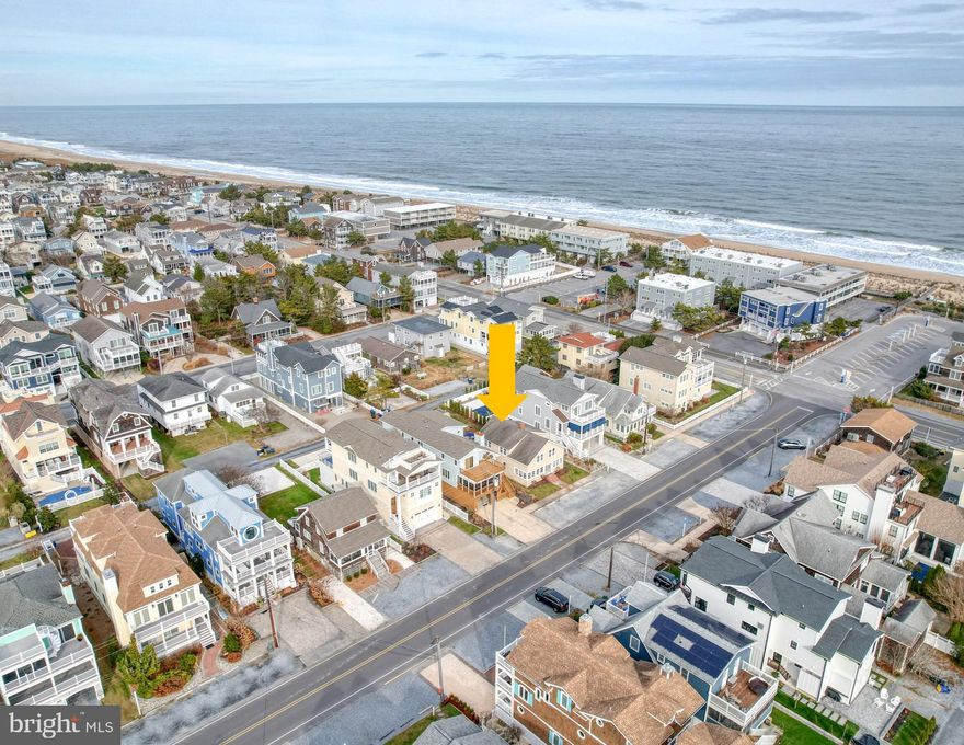 Rare Opportunity — Two Versatile Units Just One Block from the Ocean in Downtown Bethany Beach!
Unlock the potential of this exceptional coastal property, ideally situated on an oversized 40’ x 125’ lot and offering two fully independent units. Whether you’re looking for a smart investment, multi-generational living, or a personal beach retreat, this home delivers unmatched flexibility. Live in one unit and rent the other, rent both for maximum income, or enjoy the entire property as your own private getaway.
The welcoming sunroom sets the tone for the first-floor unit, which features a comfortable family room with fireplace, well-appointed kitchen, dining room, laundry room, one bedroom, and one full bath—perfect for easy beach living. The second-floor unit boasts a private side entrance and offers generous space with an eat-in kitchen, family room, full bath, and four bedrooms, ideal for hosting guests or generating rental income.  After a day at the beach, rinse off in the outdoor shower, then relax or entertain on the backyard patio. A convenient storage shed keeps bikes, beach chairs, and all your coastal essentials organized and ready to go.  Home has been well maintained and is ready to rent or enjoy yourself, renovate to your liking, or build a new home!  Recent updates include two new HVAC units and hot water heater.  Park the car and enjoy the walkable lifestyle Bethany Beach is known for—restaurants, shops, the boardwalk, and the Atlantic Ocean are all just steps away.
Don’t miss the video tour—start living the Bethany Beach lifestyle today!