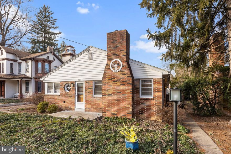 Nestled in the heart of the historic Old Town District in Mechanicsburg Borough, this expansive all-brick ranch stands proudly along Main Street. Boasting over 2100 square feet of living space on the main level and an additional 1000+ square feet in the lower level.  Upon entry, the charm of hardwood floors guides you through the spacious living areas, a grand fireplace takes center stage in the massive living room. The kitchen is equipped with stainless steel appliances and features a retro built-in booth for a touch of character.  Adjacent to the kitchen is a formal dining space.  The primary bedroom offers an updated ensuite bath.  Three additional generously-sized bedrooms boast ample closet space and share a full bath; while there is also powder room on the main level. The lower level, with over 1000 square feet of partially finished space, provides endless possibilities.  There is ample off-street parking, and the convenience of an attached 2-car garage as well.