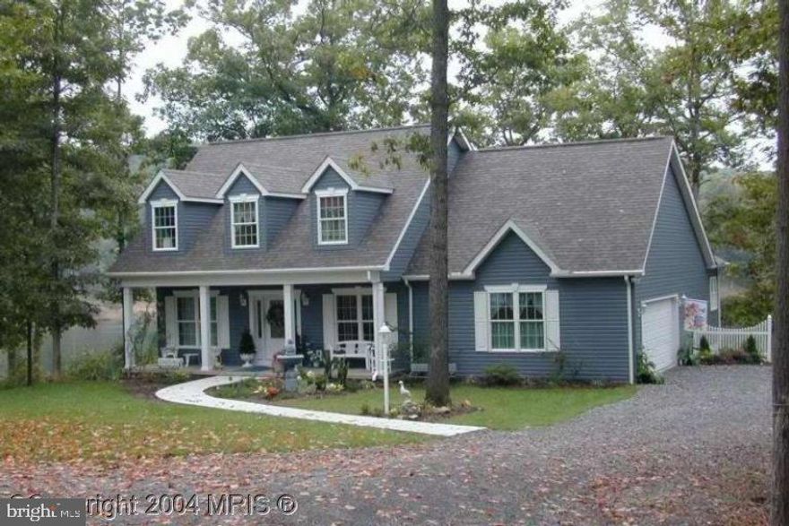 145' of WATERFRONT! Enjoy the to die for WATER VIEWs from: your primary bedroom w/ door to deck, Primary Bath, great room + breakfast room! Bamboo flooring present in foyer, kitchen/breakfast rm. Main floor living includes laundry and primary bedroom/bath! Here's your opportunity to be lakefront in a very comfortably sized home with loads of privacy from the cul-de-sac, a dock, a deck on which to sit and relax and look at the LAKE!!! Lower level is completely furnished and with just the addition of a kitchenette could easily serve as in-law quarters or living space for a grown child. Walk-out level from the lower level makes access to the joys of the lake yours with just a few steps. DOCK present and conveys. Shed for storage present. Rare opportunity for this much lakefront...beautifully situated on a .70 acre lot.